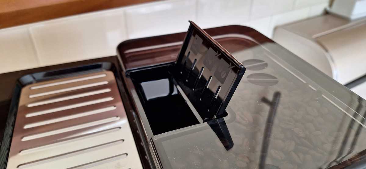 A view of the DeLonghi Eletta Explore ground coffee chute