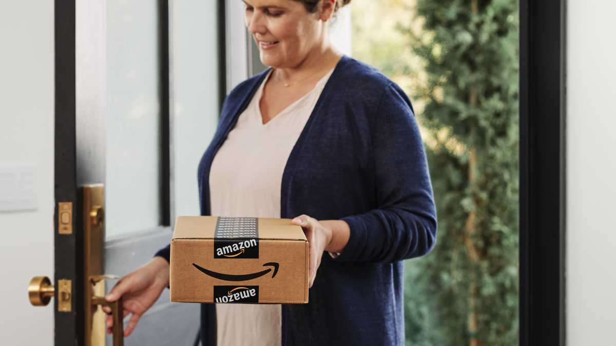 Woman holding Amazon box