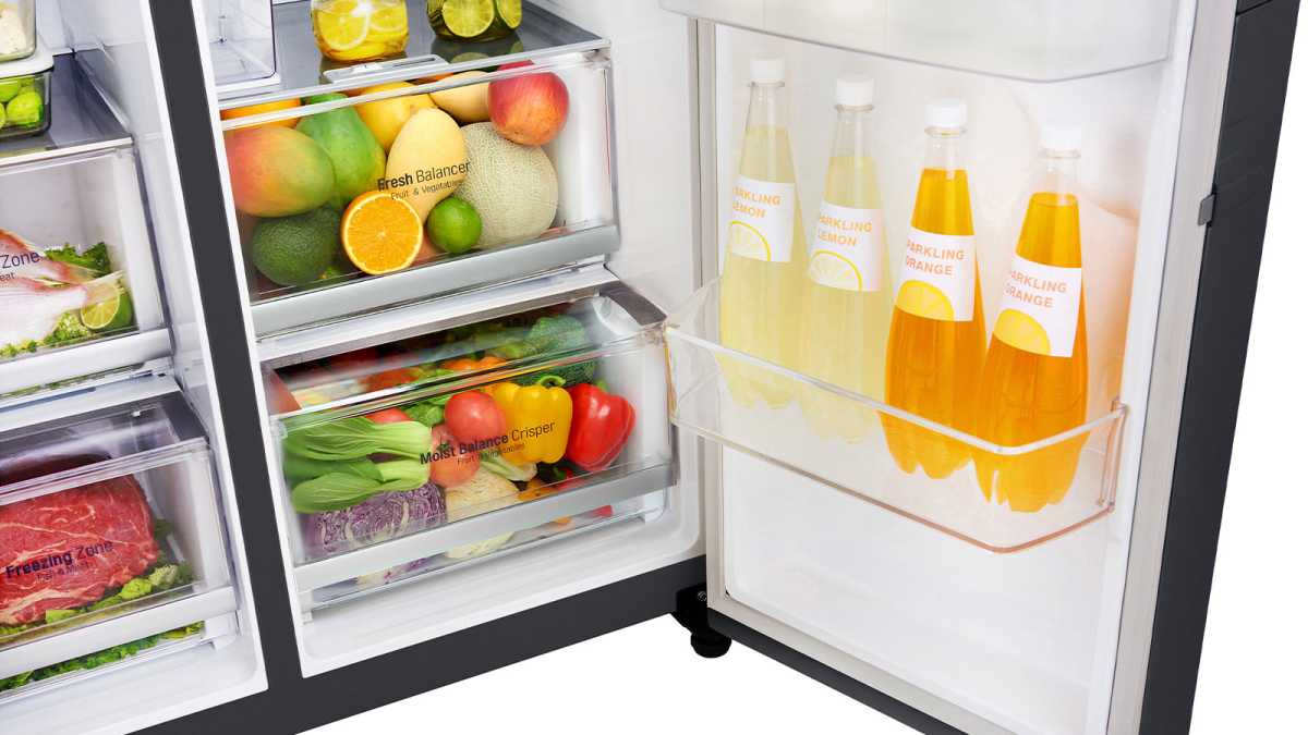 Crisper drawers filled with fruit and vegetables in a fridge