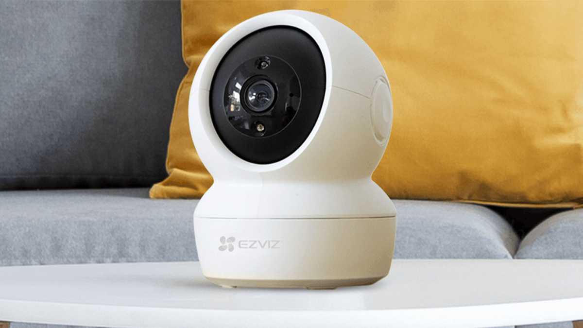 EZVIZ indoor camera on a table in front of a sofa