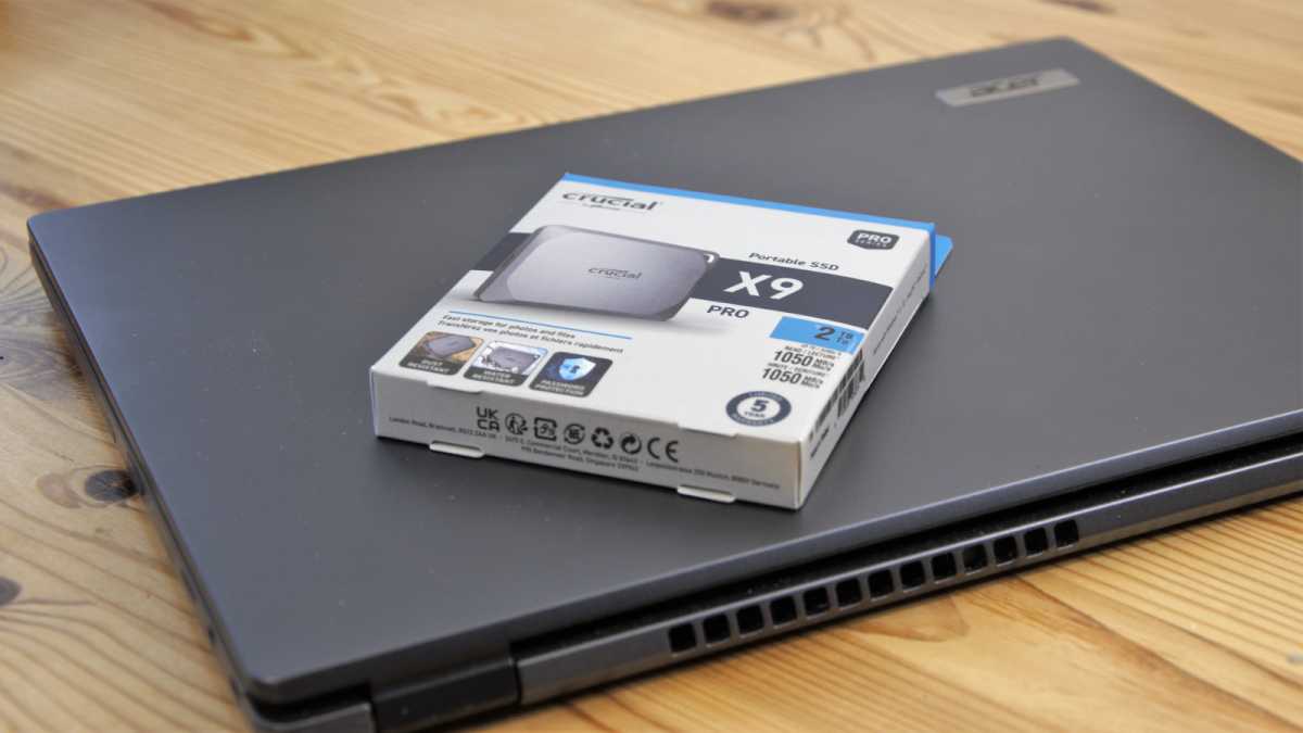 Crucial X9 Pro 2TB Packaging angled on a laptop