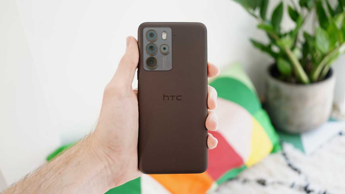 HTC U23 Pro in hand rear