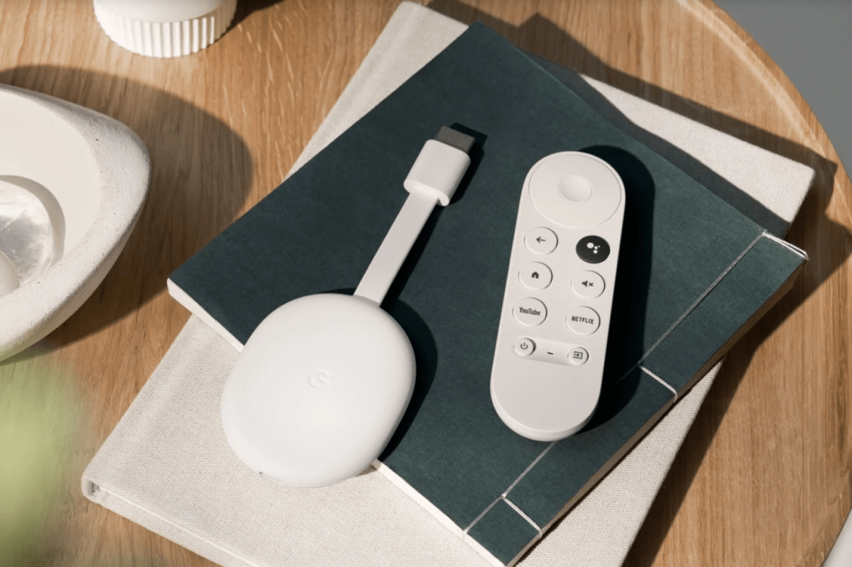 Google Chromecast on a stack of books on a table