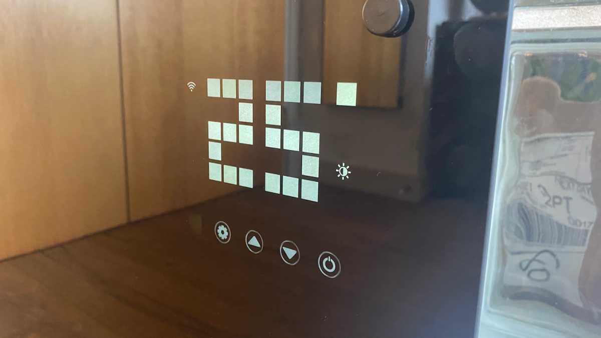 Devola smart glass panel display showing temperature