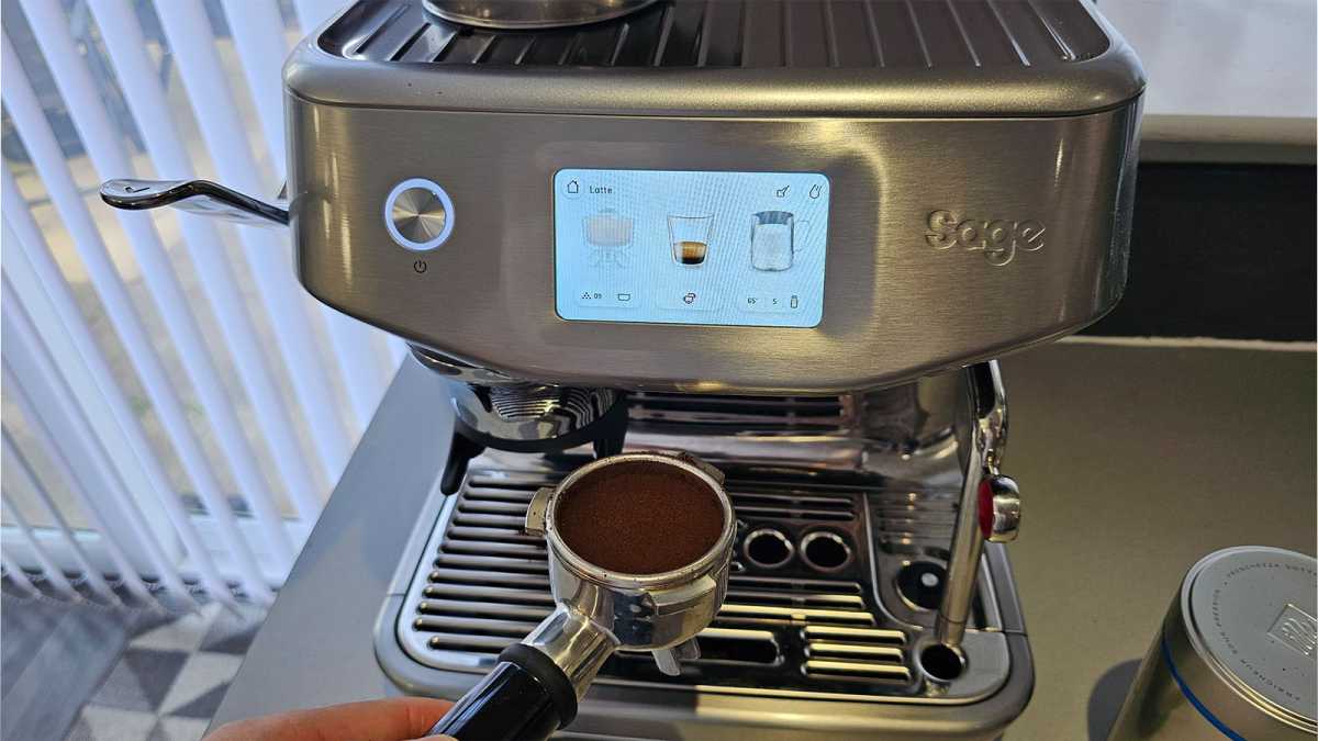 Barista Touch Impress portafilter ready to be brewed