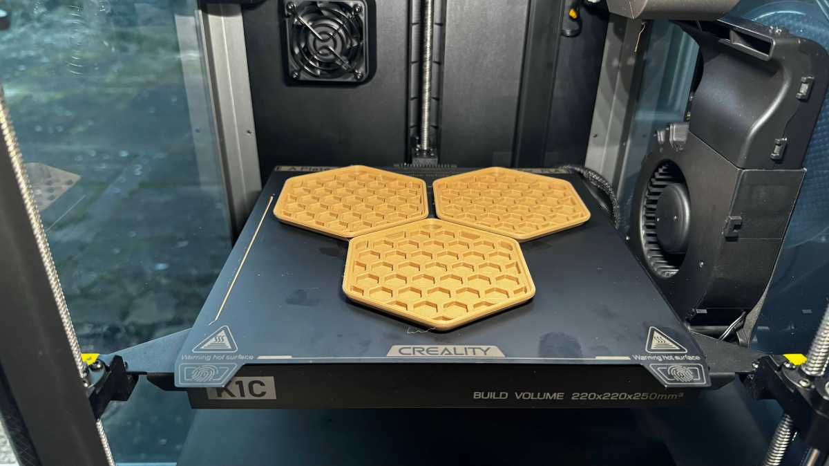 Creality K1C 3D printer printing coasters in CR-Wood