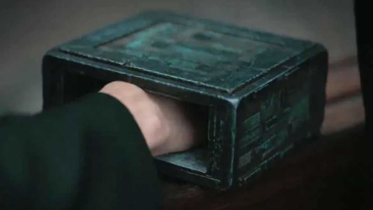 A hand in the Bene Gesserit box from Dune
