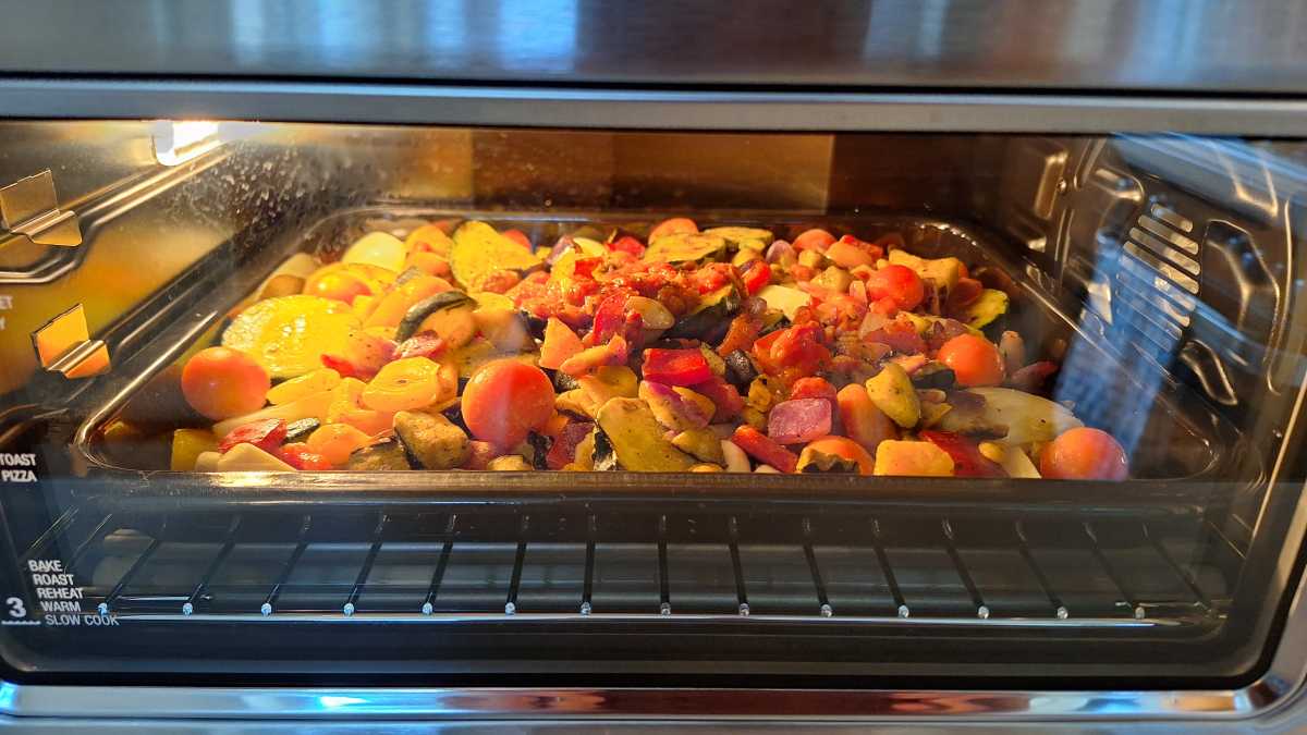 A view of vegetables roasting in the Sage Smart Oven Air Fryer