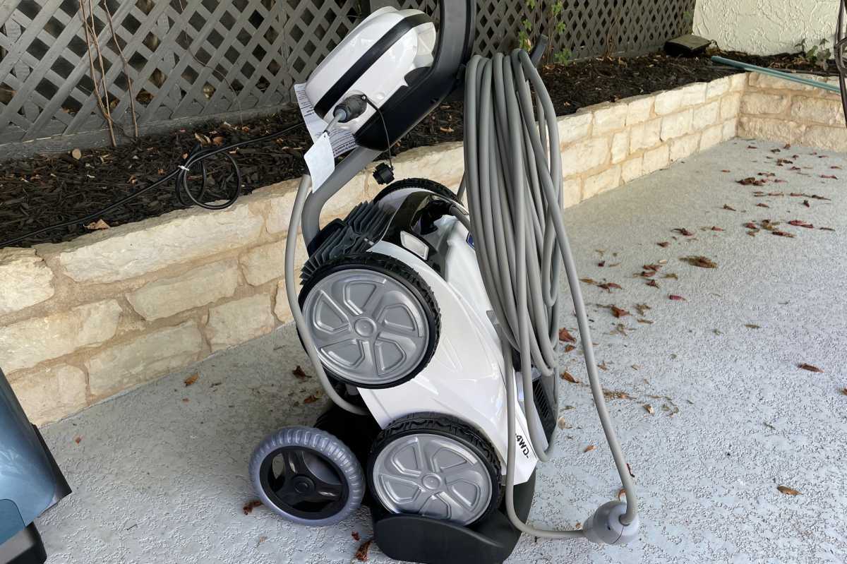 Polaris VRX iQ+ pool-cleaning robot in caddy