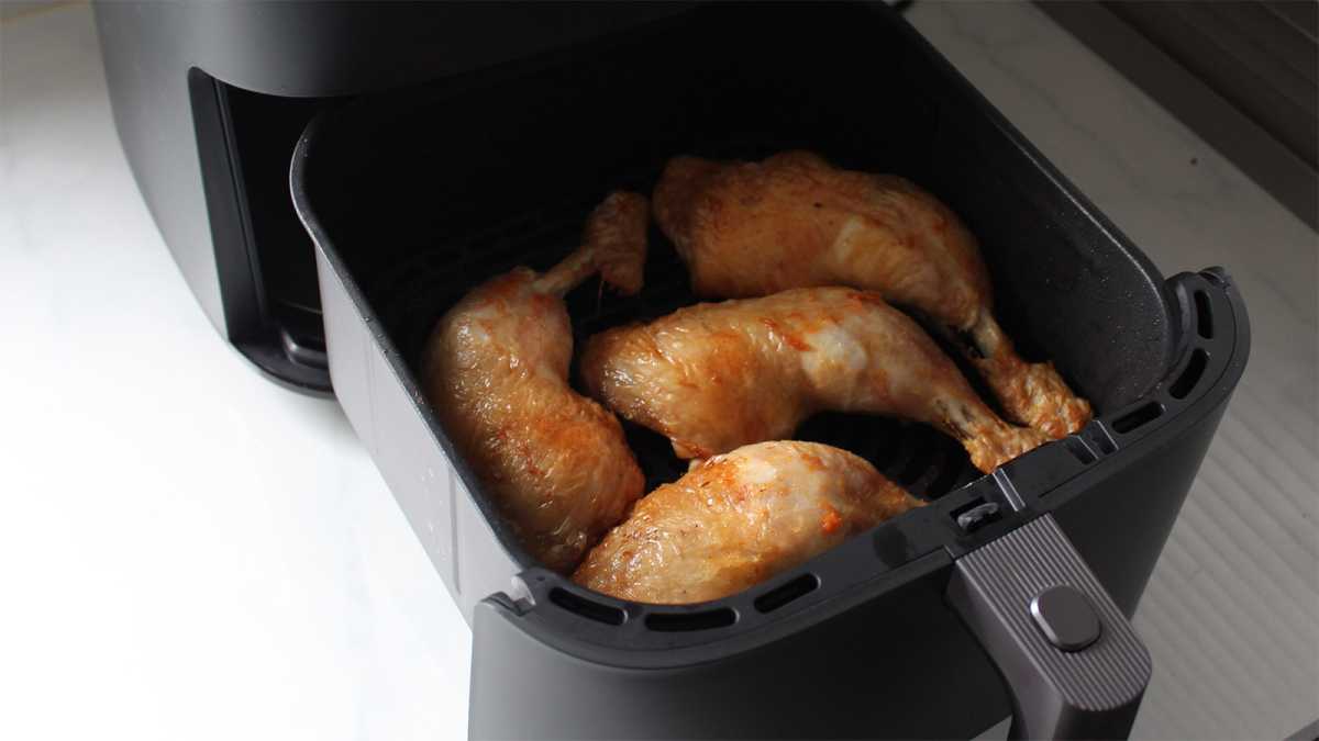 Four chicken legs cooked in the air fryer