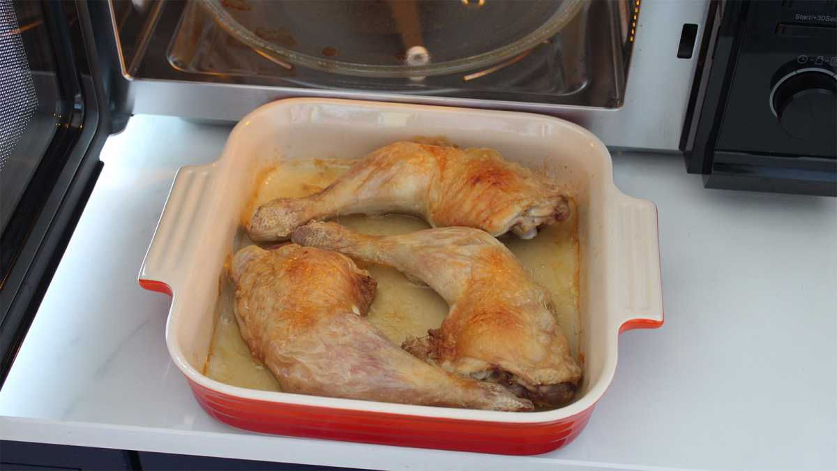 Chicken in a dish in front of the appliance