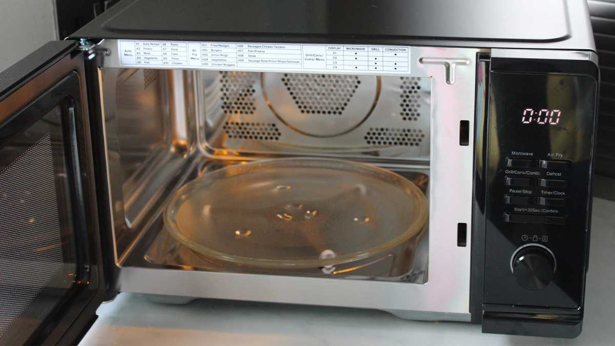 The glass turntable inside the microwave air fryer