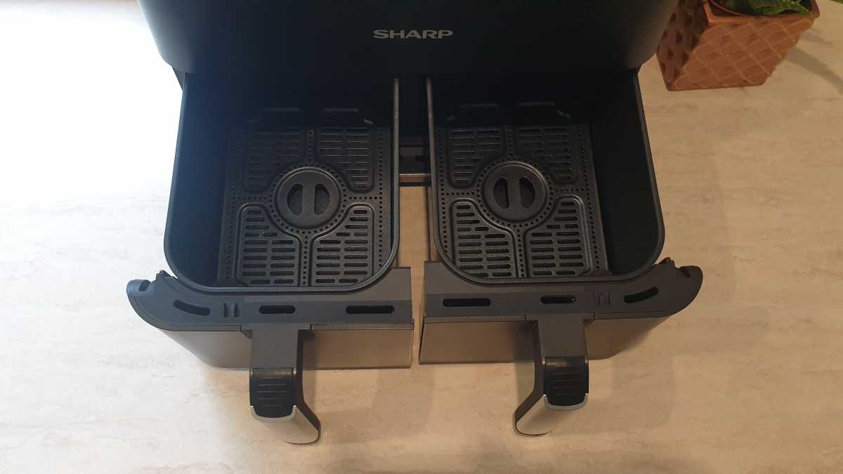 A view of the inside of the Sharp Dual Drawer 8l Digital Air Fryer with Sync Finish dual drawers