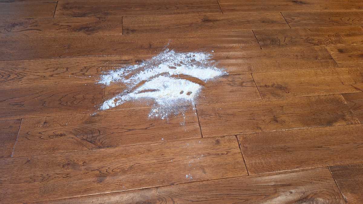 A view of flour on the floor before the Gtech Orca flour test.