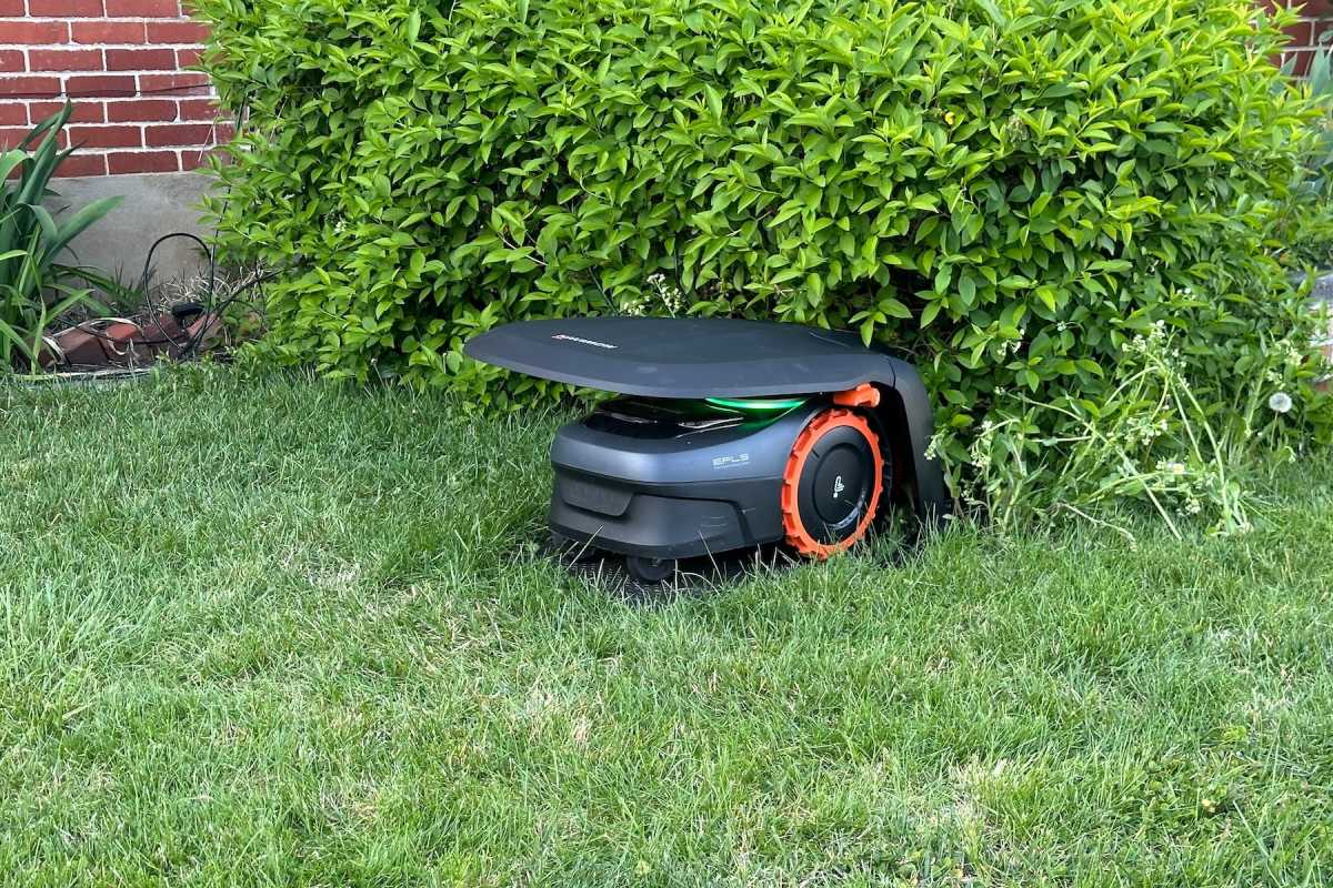 Segway Navimow i110N robot lawn mower docked in its garage