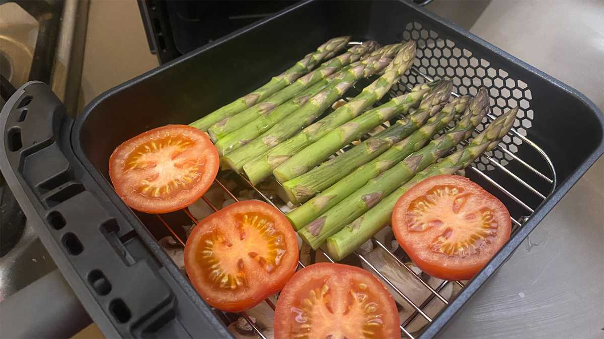 Two layers of vegetables ready to be placed in the air fryer