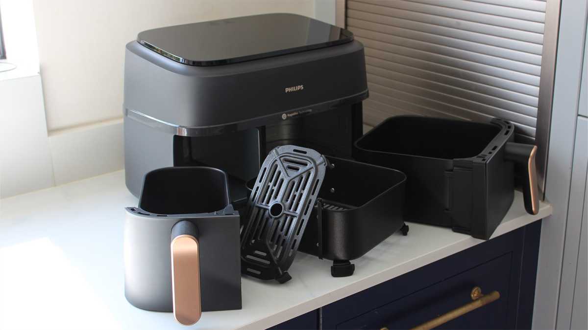 The drawers and cooking inserts in front of the air fryer