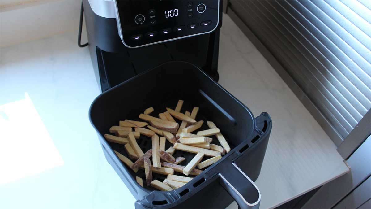 A basket of chips in an air fryer