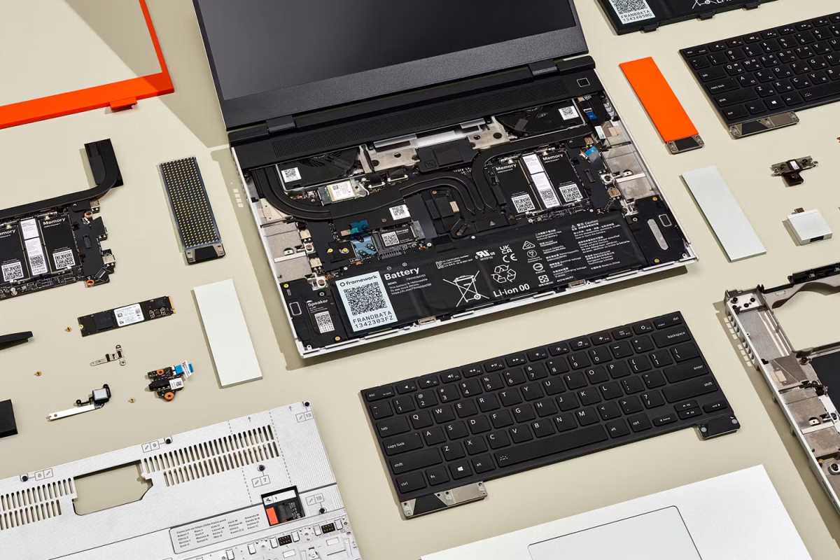 Framework Laptop taken apart with parts ordered neatly