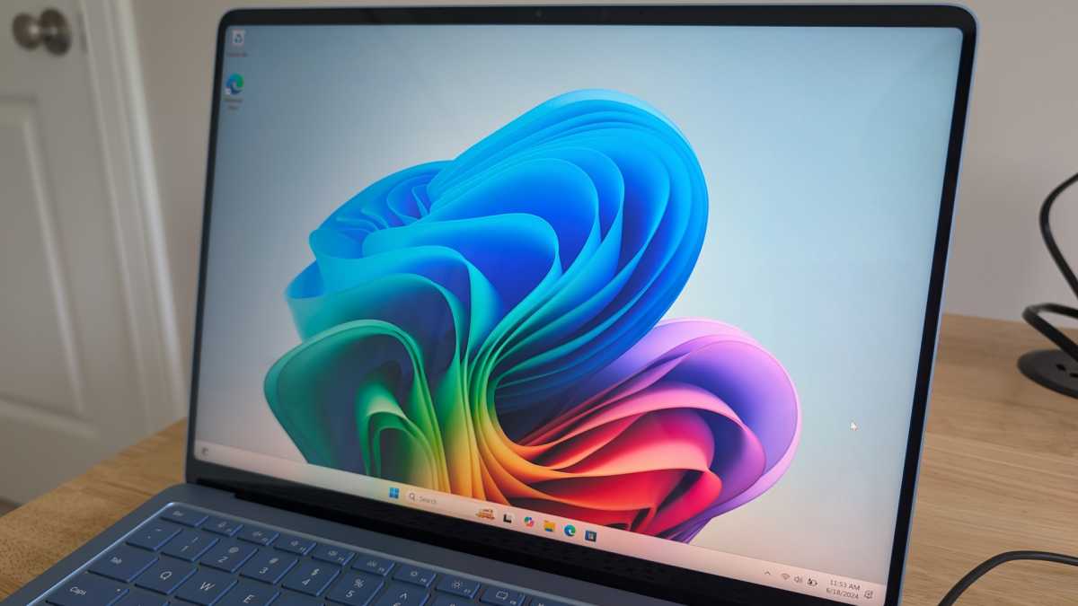 Microsoft Surface Laptop display closeup with Copilot background