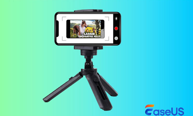 A phone on a tripod against an ombre background