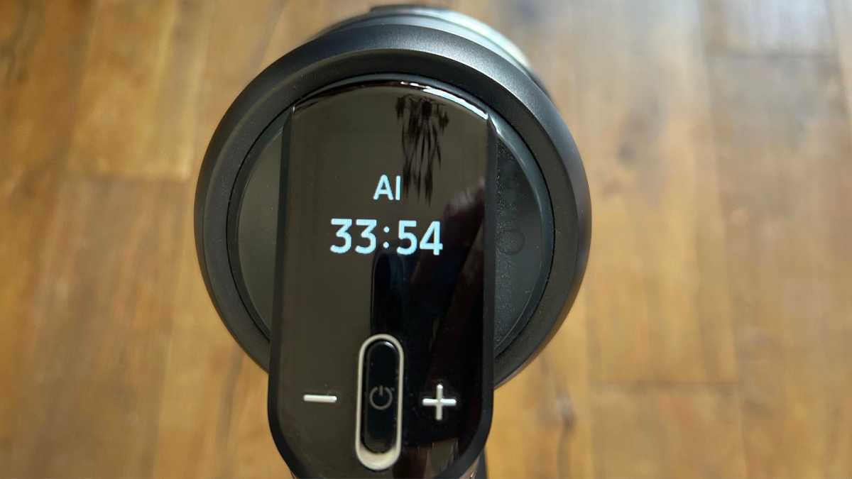 The display on the vacuum cleaner, showing mode and cleaning time remaining