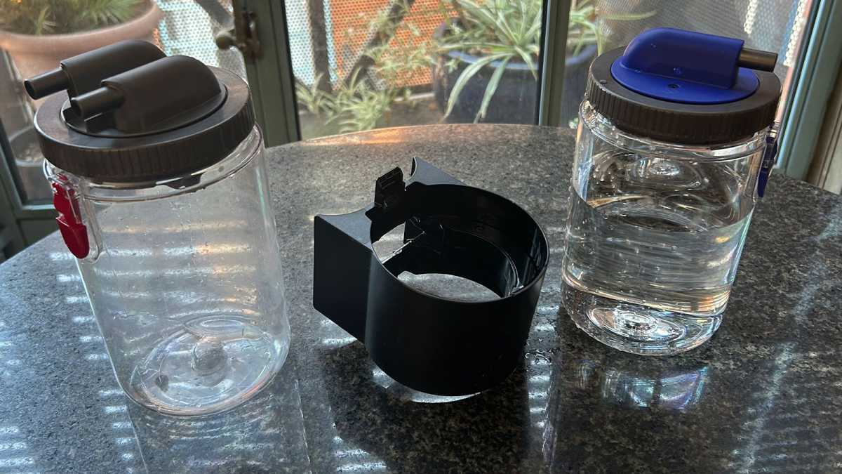 Dirty and clean water tanks on a table