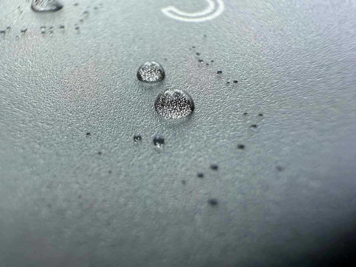 iPhone 16 Pro Max Sample Macro Photo of water droplets on another phone