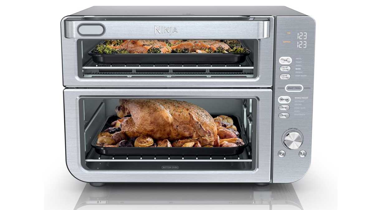 Ninja's air fryer oven, with a roast chicken cooking inside