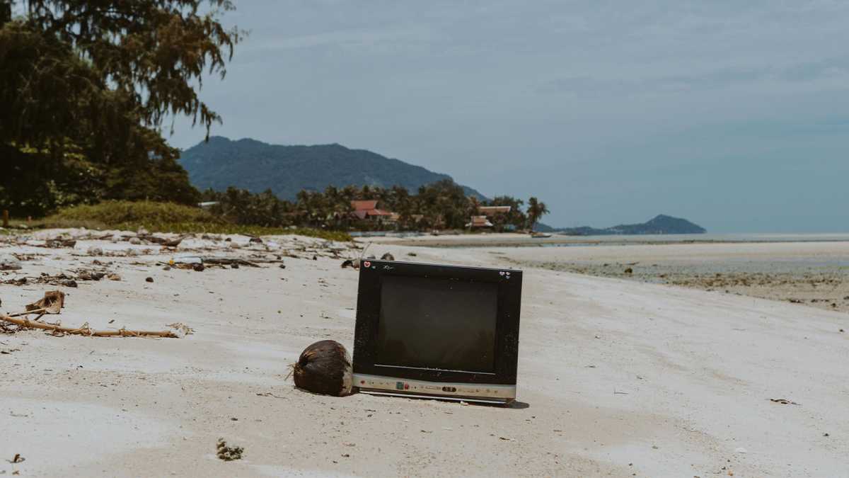 A TV abandoned on a beach