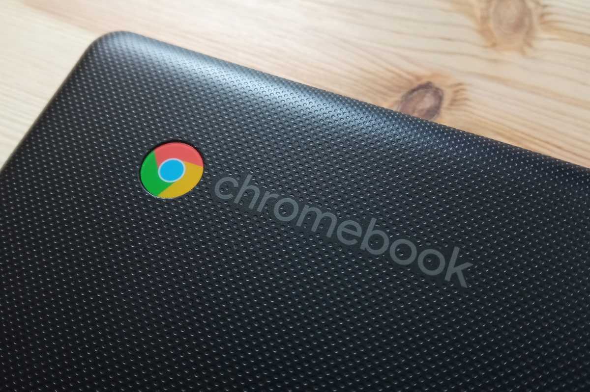 Chromebook logo closeup on black laptop lid hero