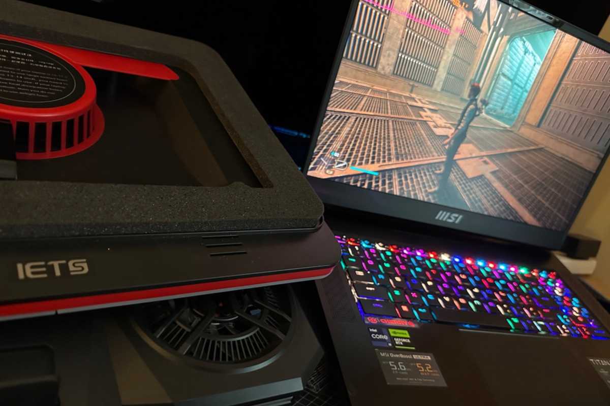 IETS laptop cooling pad next to MSI gaming laptop