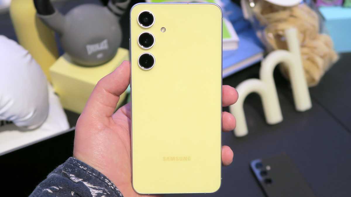 Samsung Galaxy S24 FE hands on back handheld