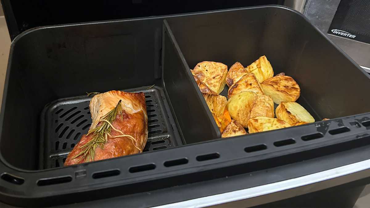 Turkey and roasted vegetables in the drawers of an air fryer