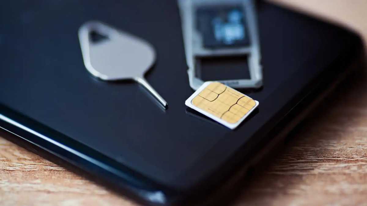 A SIM card on top of a phone