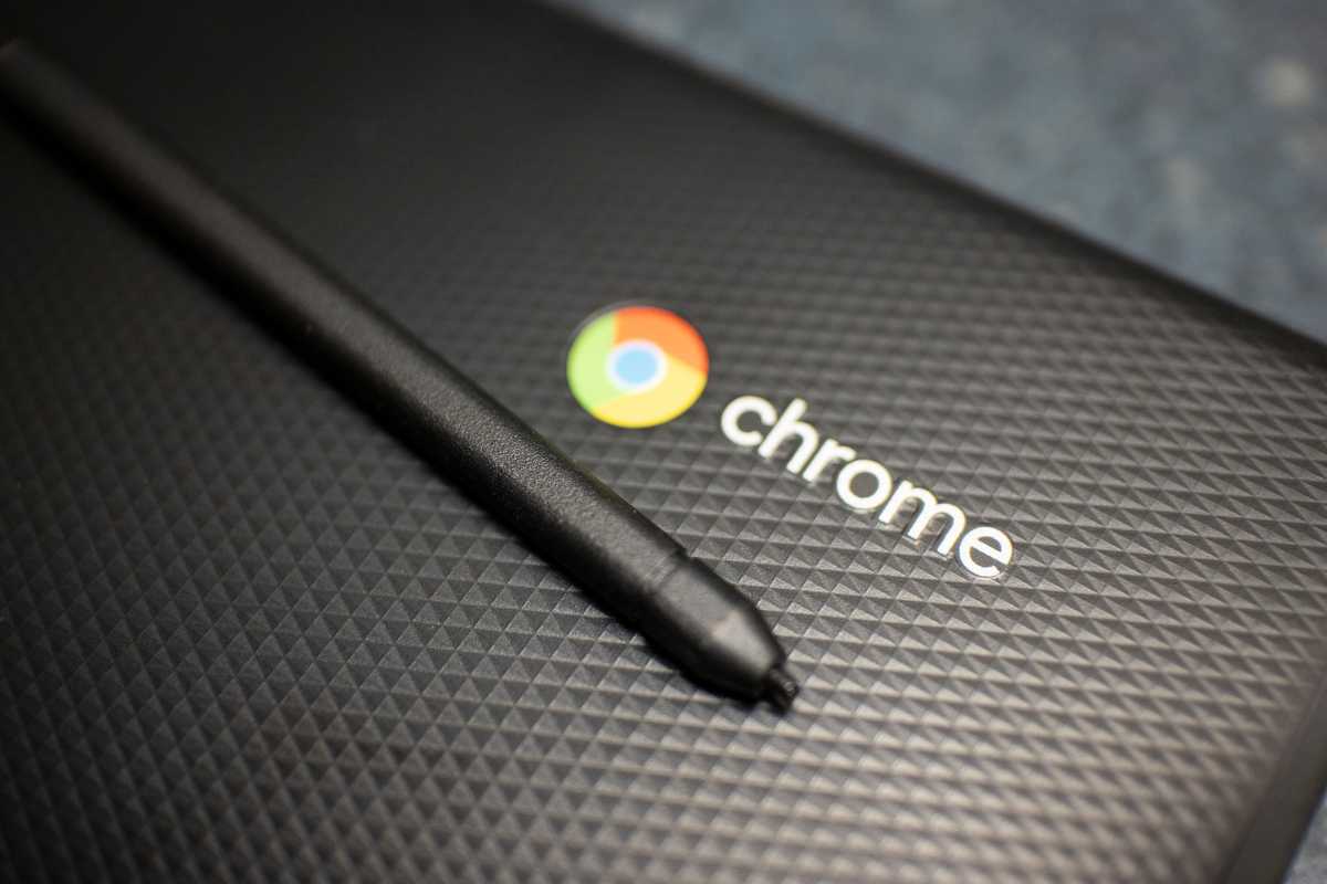 Closed Chromebook lid with stylus on top