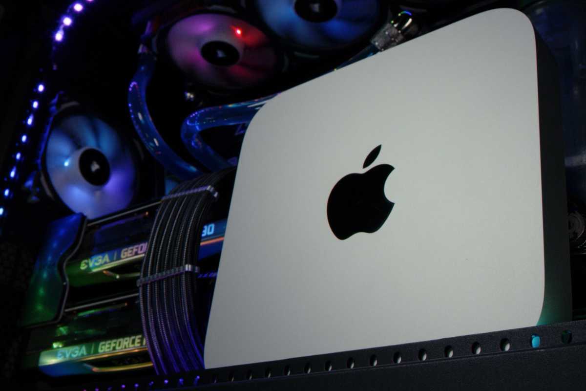 Closeup of a Mac Mini next to Nvidia GeForce RTX 4090 graphics card