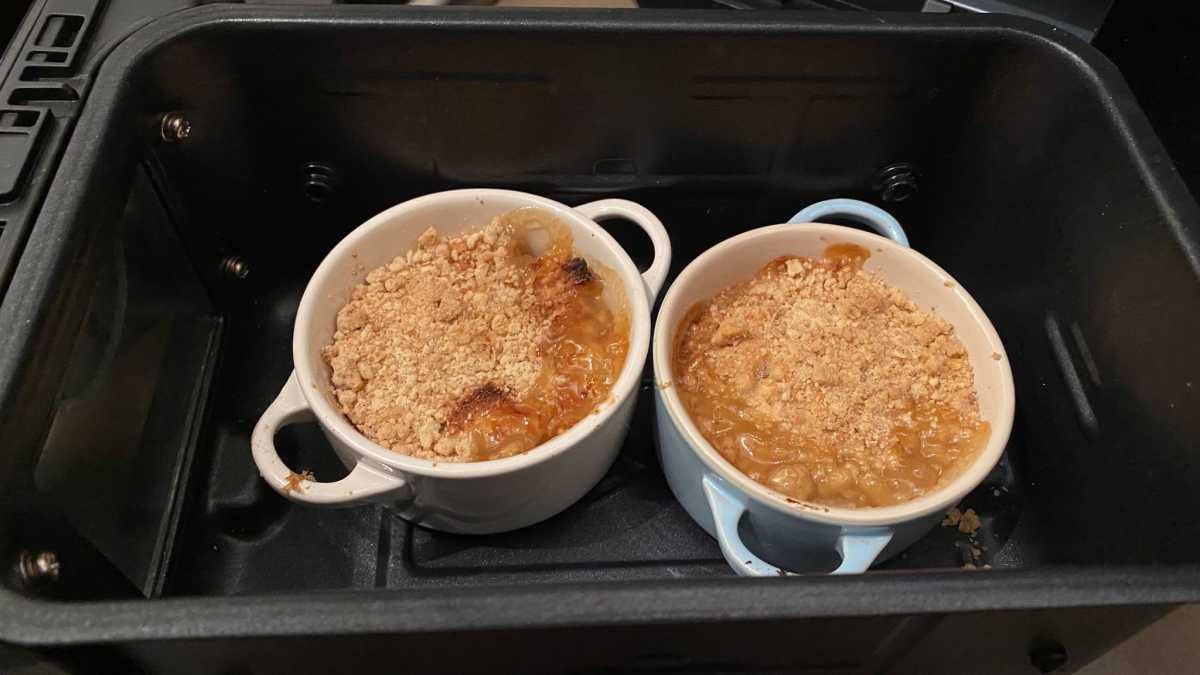 Two Le Creuset pots in an air fryer drawer