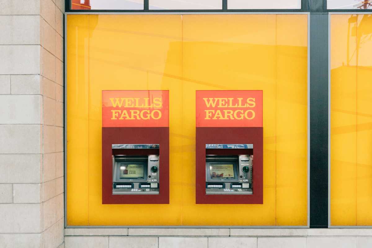 Wells Fargo ATM machines in a yellow wall