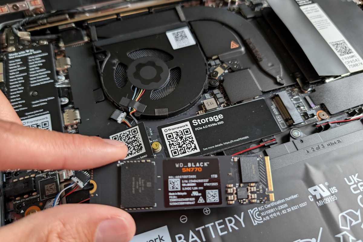 Framework Laptop opened up and SSD being installed