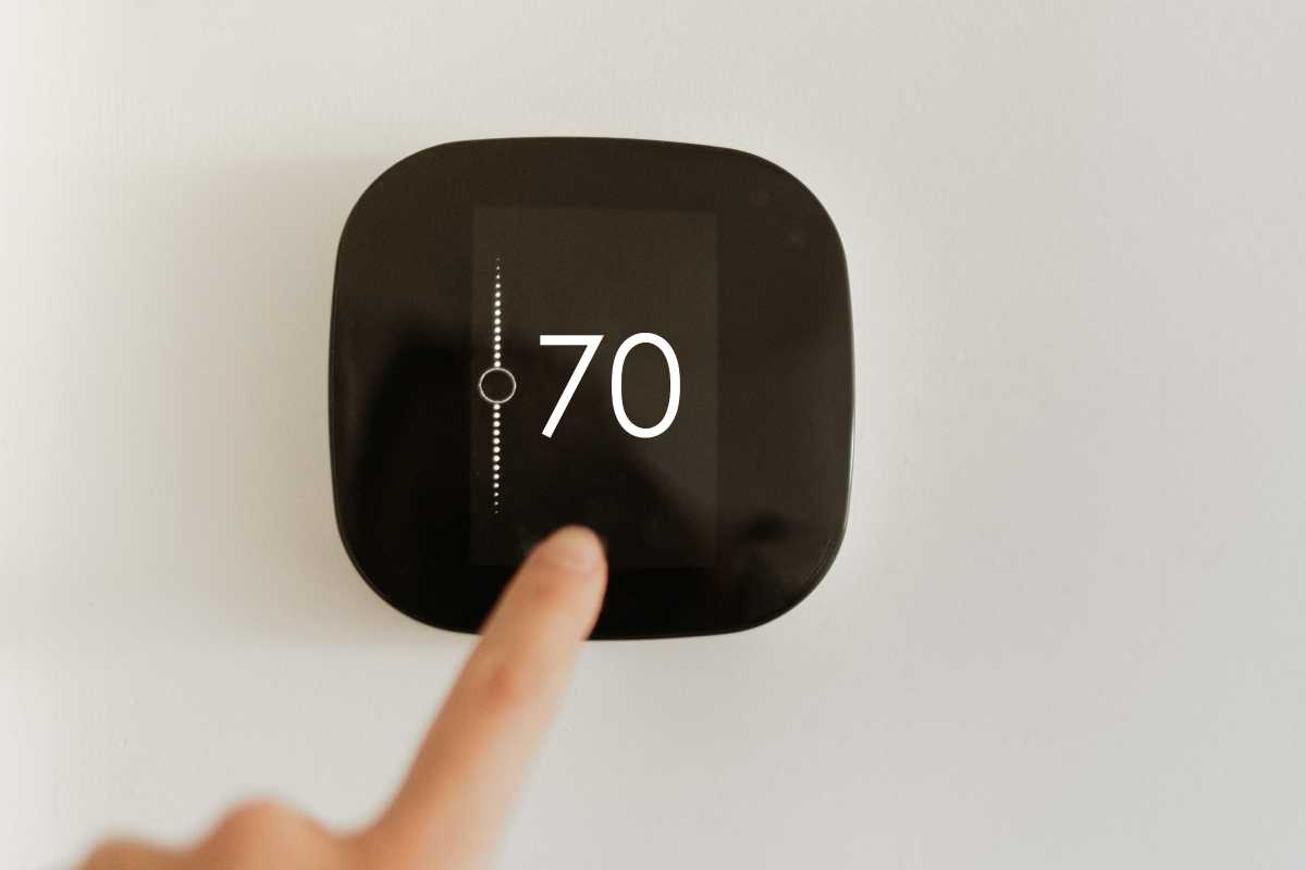 Home smart thermostat set to 70 degree temperature