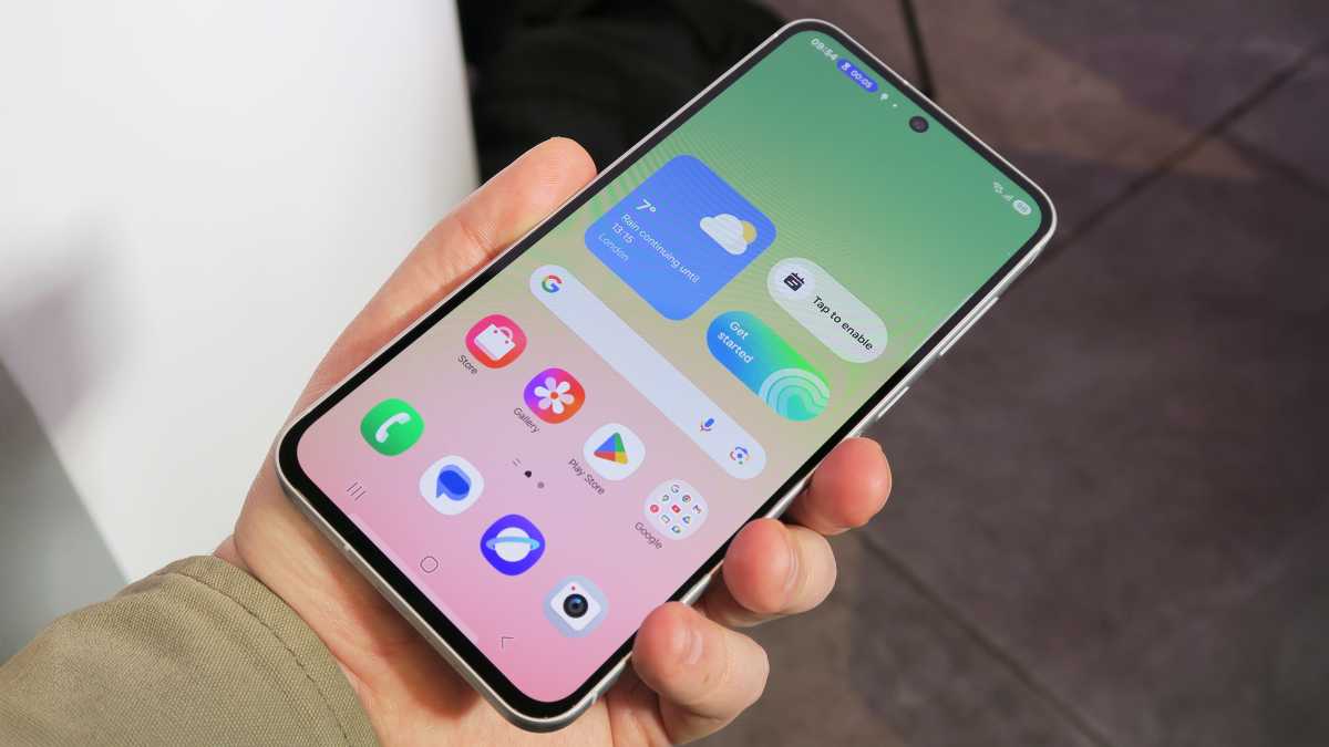 Samsung Galaxy A56 hands on front handheld home screen angled
