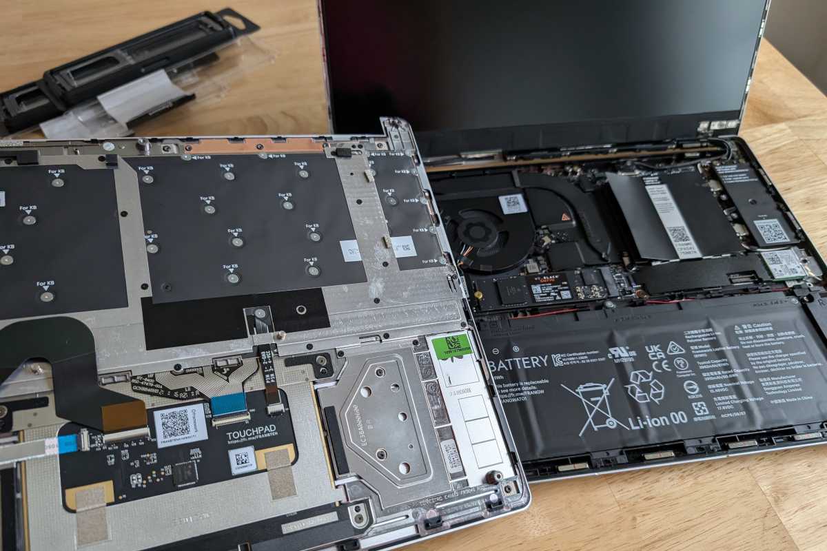 Framework Laptop 13 disassembled with pieces and internal components