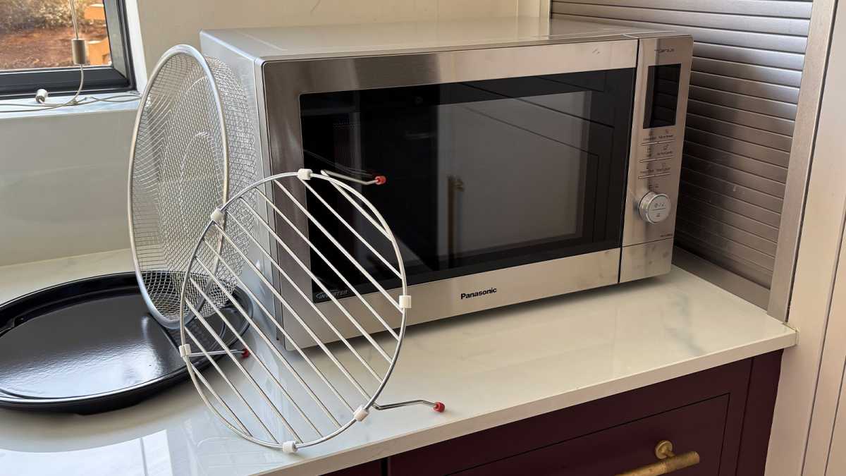 The enamel tray, wire rack and basket beside the combi oven