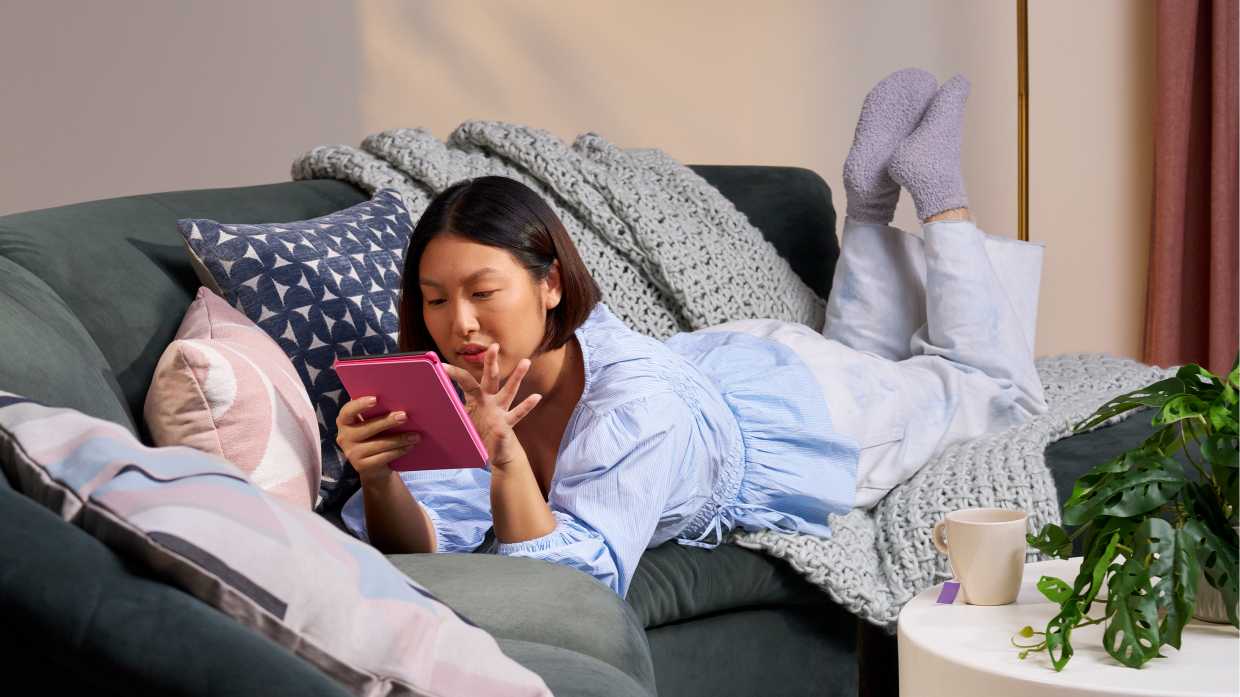 Woman reading on Kindle
