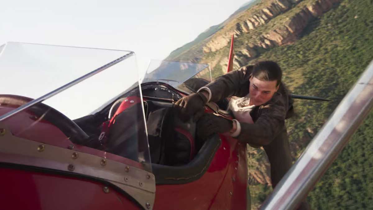 Tom Cruise hanging off a biplane in The Final Reckoning