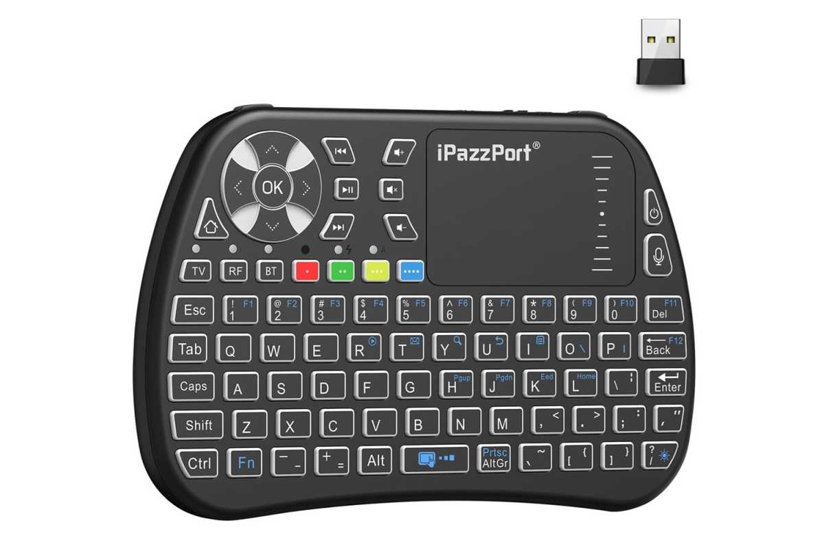 A small remote with a keyboard on the bottom and a row of remote-like controls and a trackpad on the top, plus a USB dongle