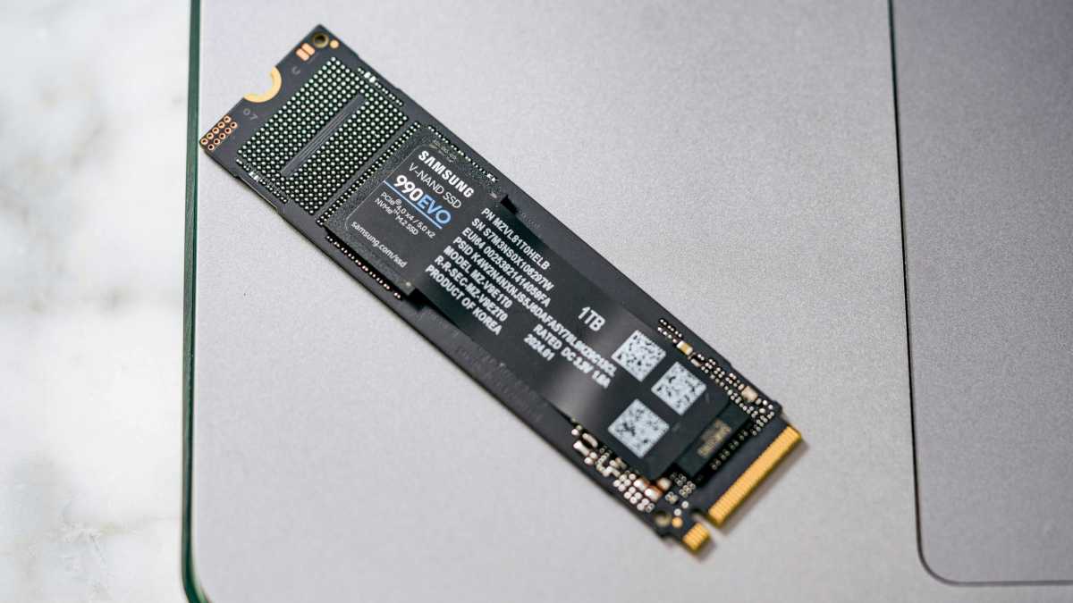 Samsung 990 EVO SSD sitting on a laptop