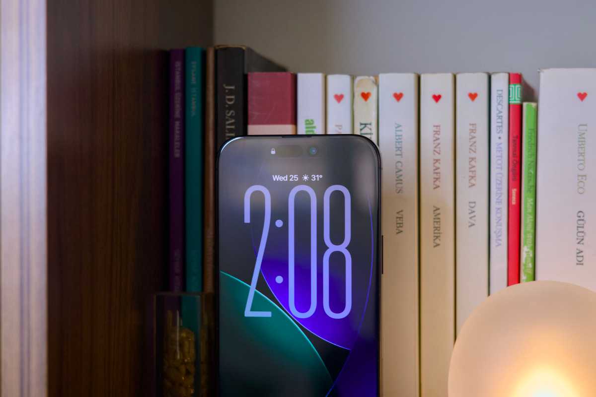 iPhone 16 Pro on a bookshelf