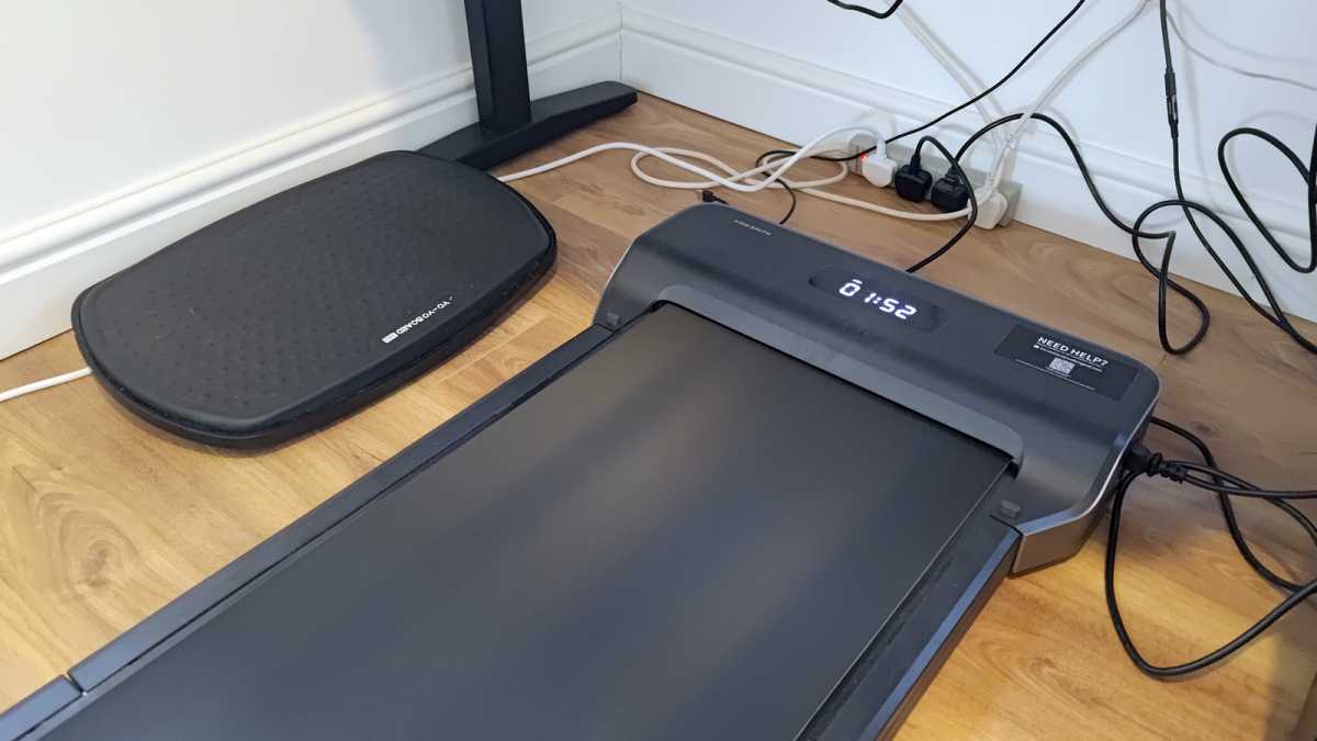 WalkingPad Z1 standing desk treadmill on ground below desk